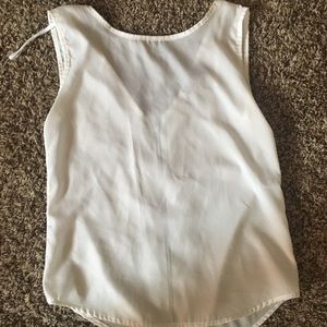 White sleeveless blouse